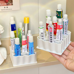 กล่องเก็บยาสูตรเหลวแบบพกพาพร้อมชั้นวางสิลิโคนสำหรับจัดระเบียบในครัวเรือน ช่องแยกส่วน 32 ช่อง ทรงสี่เหลี่ยม สีขาว