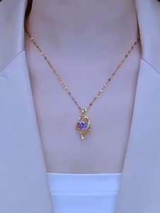 A gold-plated Heart-Shaped Pendant Necklace Inlaid With Purple Crystals Features A Unique Design And A Stylish Minimalist Korean Style Making It A Fashionable Jewelry Gift For Women.