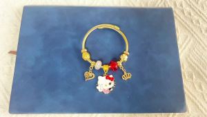 Sanrio | Gold Plated Hello Kitty Open Bangle Zinc Alloy with Red Crystal & Crown Charms Adjustable Cuff Bracelet for Girls