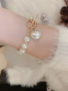 Elegant สไตล์ฝรั่งเศส Pearl Heart สร้อยข้อมือผู้หญิงที่ละเอียดอ่อนหยดน้ํา Bell รูปแบบผสมวัสดุหรูหราน้ําหนักเบาเครื่องประดับ