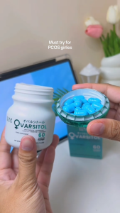KM OVARSITOL supplement bottle and box. White bottle with green cap. Blue box with white text. 60 capsules 500mg. No approved therapeutic claims.