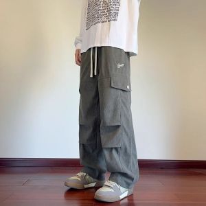 Quần Nhung Kẻ Nam Mùa Xuân Thu Mới Trẻ Trung Đường Phố Mỏng Ống Thẳng Quần Áo Công Sở Nhiều Túi Quần Ống Rộng