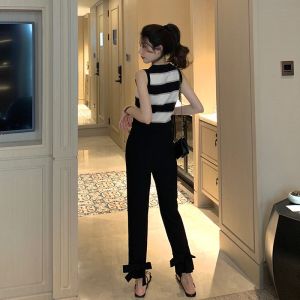 กางเกงขายาวทรงหลวมเอวสูงสีดำสำหรับผู้หญิง ทรงเข้ารูป ทรงสลิมฟิต ทรงตรง ทรงเก้าส่วน ทรงเข้ารูป กางเกงขายาวลำลอง