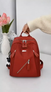 VIVI BAGS#8868 Functoinal backpack for womens students nylon water-repellent nylon or oxford spinning fabric and often includes a decorative bear keychain.