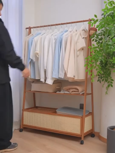 Juans Home Hub wooden clothing rack with wheels shelves and woven basket suitable for bedroom use.