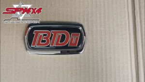 ตัวหนังสือติดข้างประตู Nissan Big-M BDI คำว่า BDi