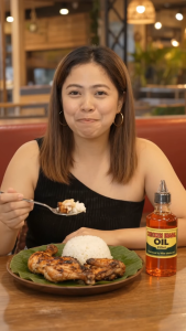Chicken Inasal Oil 250ml - Reddish liquid plastic bottle with black cap cooked chicken and rice.