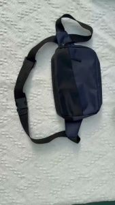 KENBAGS#4034 Crossbody waist bag for Men features a modern minimalist design with a distinct diagonal front zipper.