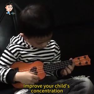 Ukulele Guitar Portable with 4 Strings A Guitar for Kids. It Is A Classic Wooden Guitar Instrument and A Toy for Cultivating Childrens Musical Talent.