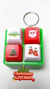 Christmas-themed four-compartment button keychain with sounds festive designs including Santa Claus Christmas tree stockings and "Merry Christmas"
