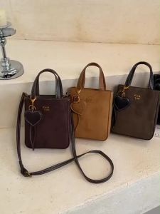 Women Mini Suede Top Handle Crossbody Bag Retro Vertical Small Handbag with Heart Charm Pendant Adjustable Strap Ladies Should