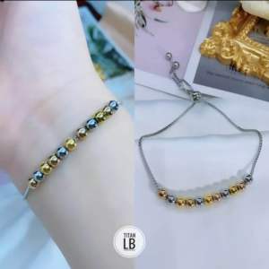 Gelang Serut Titanium Bola Mix Gold Dan Silver CXB434