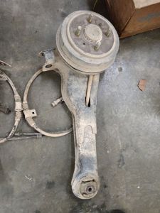 Proton wira rear suspension link with brake hub and cable