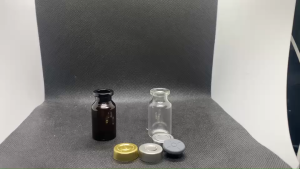 ขวด 10 มล. (50ใบ) ใส แก้ว ไหล่เอียง + จุกเทา + ฝาflip off ชั้นเดียว#20มม.(รูปภาพฝายังไม่ถูกปิดล็อค)