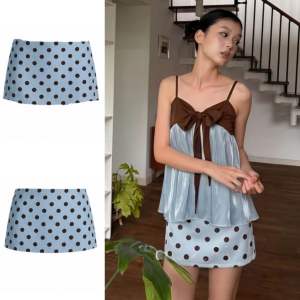 Set đồ nữ xinh xắn gồm áo babydoll chất Voan Tơ mỏng thiết kế thắt nơ ngực phối chân váy bi ngắn