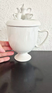 Mug with pot on top on cover
