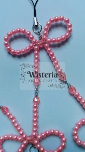 Aksesori manik gantungan hp bentuk pita pink