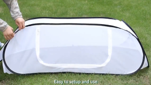 Portable plant greenhouse with a removable zipped door ideal for growing vegetables and flowers outdoors