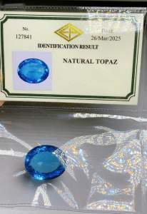 ธนาภรณ์✨พลอยบลูโทพาส 59.144 กะรัต รูปไข่ สีน้ำเงิน ไฟวิ้ง  พร้อมใบเซอร์พลอยแท้100%(GSH1163)