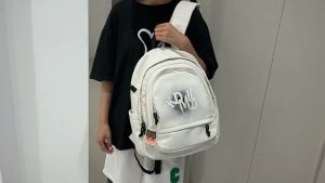 กระเป๋านักเรียนหญิง 2024 ใหม่เกาหลีรุ่น Mori ฮาราจูกุเป้สะพายหลังเรียบง่ายแฟชั่นเปลี่ยนสีคำกระเป๋านักศึกษาวิทยาลัย