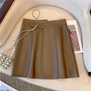 กระโปรงสั้นทรงเอเอวสูงสำหรับผู้หญิงไซส์ใหญ่ กระโปรงหนัง PU ทรงเข้ารูป กระโปรงแฟชั่นสำหรับคุณแม่ที่เผ็ดร้อน ฤดูใบไม้ร่วง/ฤดูหนาว