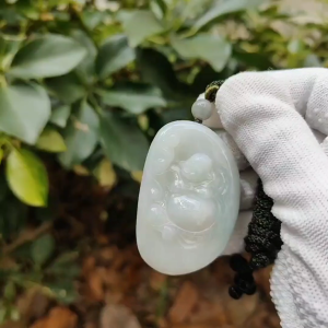 Radiant Jadeite Serenity Laughing Buddha Pendant – Light Green Hue with Auspicious Ball (Sku:pendant454)