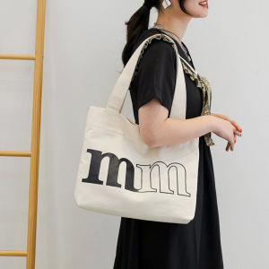 กระเป๋าสะพายไหล่ผ้าแคนวาสลายตัวอักษรสไตล์เกาหลีสำหรับผู้หญิง กระเป๋าใส่เอกสาร กระเป๋าใส่หนังสือสำหรับนักเรียน กระเป๋าใส่ของสำหรับเด็กโต กระเป๋าสะพายไหล่แบบหนังสือ