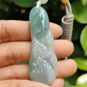 Good Quality Beautiful Natural Type A Jadeite Jade Light Green with Green Hue crafted with Dragon as Pendant QIC labs approved certificated weigh 15.74 grams measurements 56 * 20.5 * 6.2 mm (pendant296)