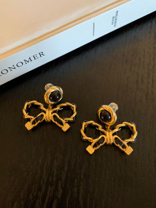 CAFFTI | Leather Bow Earrings Black and Gold Contrast