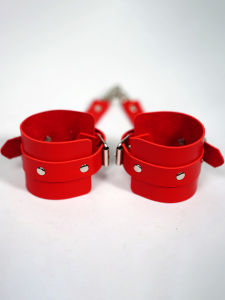 Red leather adjustable wrist restraints with metal buckles adult novelty item Valentines Day gift