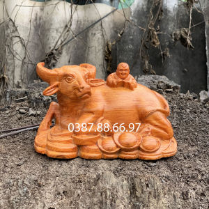 Tượng trâu em bé chiều dài 20cm chất liệu gỗ hương cực đẹp