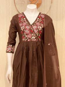 Brown embroidered mulcotton dress with matching dupatta. Three-quarter sleeves. V-neckline. Suitable for office wear and temple wear.top with pockets
