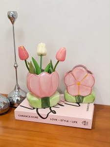 Ceramic pen holder with flower decorative pieces and storage bucket