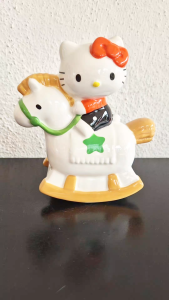Sanrio Hello Kitty on a rocking horse coin bank