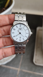 Đồng hồ nữ Technos mặt trắng men chạy pin hàng Si