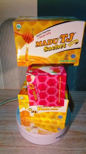 MADU TJ RASA SACHET 1 BOX ISI 12 SACHET RASA JERUK DAN STRAWBERRY.