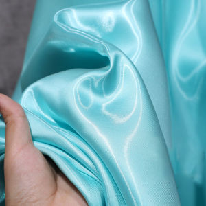 Blue liquid glossy satin crisp reflective fabric sewn party dress pants jacket handmade DIY designer fabric