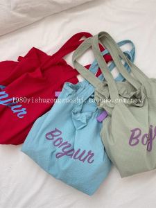 กระเป๋าผ้าแคนวาสทรงสี่เหลี่ยมตัวอักษรแบบลำลองความจุขนาดใหญ่พร้อมเชือกผูกไหล่กระเป๋าเดินทางแบบลำลองสำหรับเยาวชน