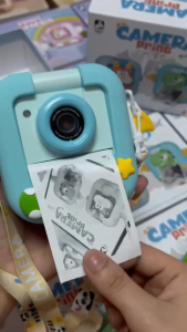 Pix & Play 1080P Kids Digital Flip & Print Camera with unicorn and dinosaur designs for selfie and photo printing.
