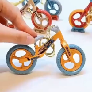 TWOL SHOP 1pcs Creative and fun movable and sliding bicycle keychain backpack pendant small gift souvenir