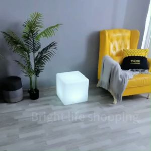 Multipurpose Cube floor lamp suitable for the living room used as a bedside table or a seat.