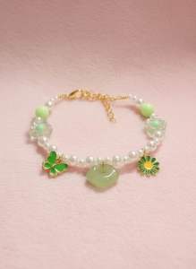 Handmade Pearl Pet Necklace with green accents featuring butterfly flower and jade-like charm. Suitable for casual or springtime wear.