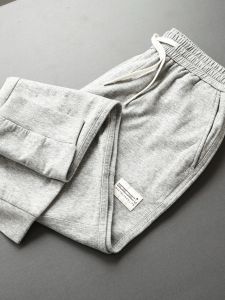 กางเกงวอร์มลำลองสำหรับผู้ชาย ทรงหลวม ผ้าฝ้าย ทรงหลวม กางเกงขายาวเอวยางยืด ทรงลำลอง สีพื้น กางเกงขายาว