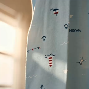 [Ne-Kids] Baby Boy Pyjamas Set - Marine Eco: 90% Bamboo 10% Cotton -Light blue top with patterns dark blue pants suitable for sleepwear in a cozy room with toys.