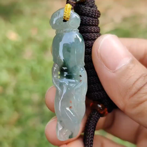 High Quality Light Green with Green Natural Type A Jadeite Jade crafted with shape of Ginseng as Pendant certificate weighs 7.63 grams measurement 48.2 * 12.7 * 7.1 mm (pendant277)