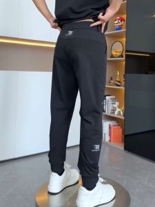 กางเกงลำลองชายผ้าไหมน้ำแข็งฤดูร้อนใหม่ ยืดหยุ่น ระบายอากาศได้ดี กางเกงขายาวทรงหลวม ผ้าตาข่ายเย็บต่อ กางเกงขายาวระบายอากาศได้ดี