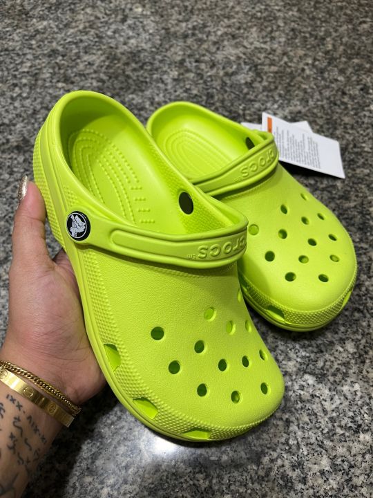 Yellow and store green crocs