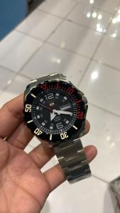 Seiko 5 stainless steel sports automatic Japan made watch with black dial and red accents.