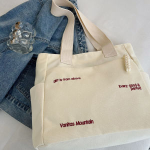 กระเป๋าผ้าแคนวาสไหล่เดี่ยวความจุขนาดใหญ่เดินทางกระเป๋าโท้ตมือถืออเนกประสงค์เวอร์ชั่นเกาหลีของผู้หญิง