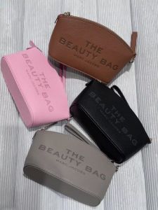 The MJ Makeup Bag Fashion cowhide Letters Womens Casual trend zippered hand-held toiletry bag